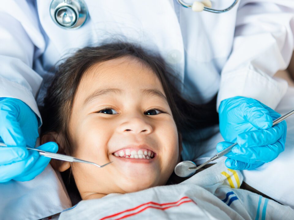 Child being examined by a dentist